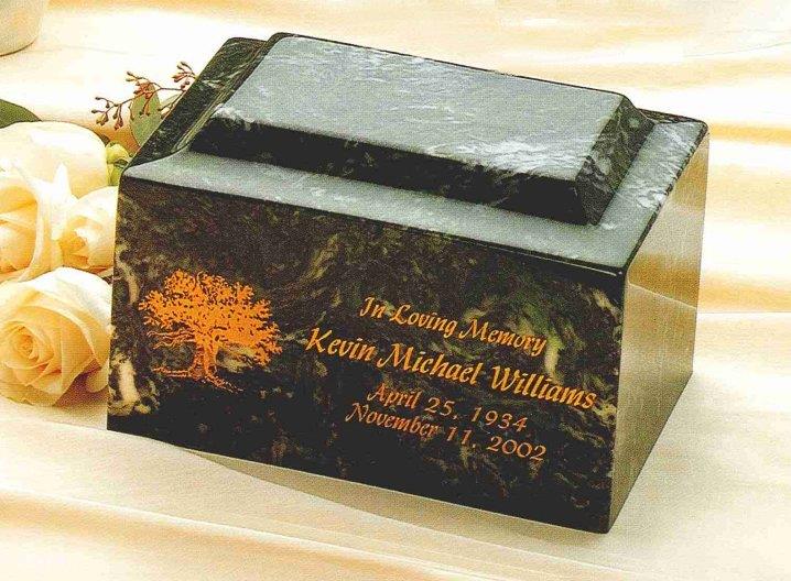 A black urn box with orange lettering. 